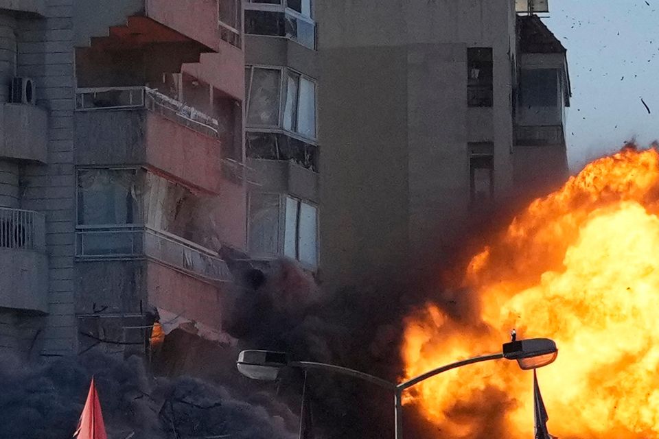 Thick smoke and flames erupt from an Israeli air strike on Tayouneh, Beirut, Lebanon (Hassan Ammar/AP)