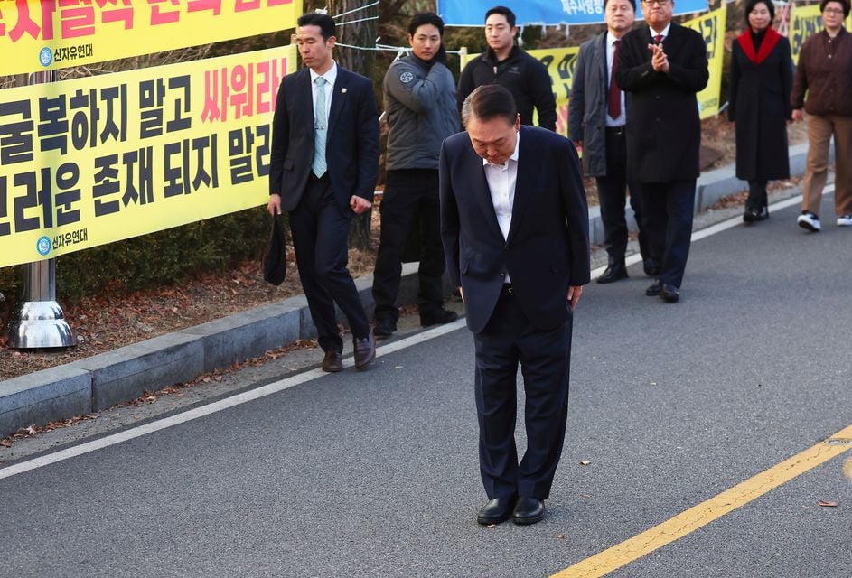 Yoon bowed to his supporters outside the centre (Yonhap via AP)