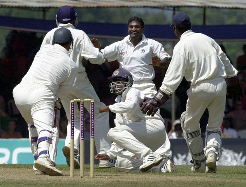 Muttiah Muralitharan, centre, is Test cricket’s record wicket-taker (Rebecca Naden/PA)