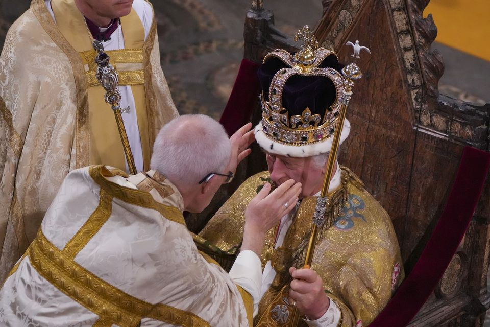 The King being crowned with St Edward’s Crown by Mr Welby (Aaron Chown/PA)