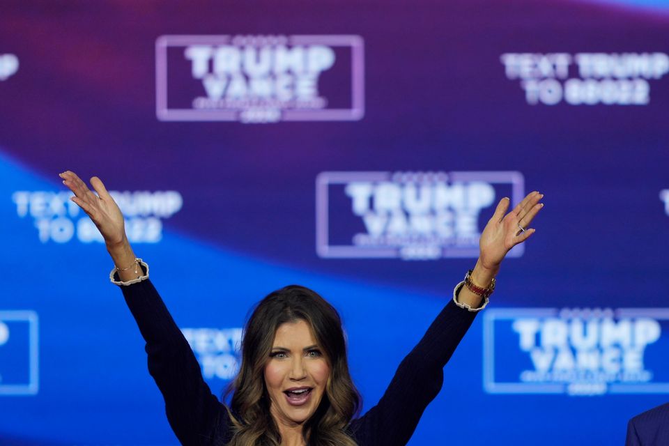 Donald Trump and South Dakota Governor Kristi Noem dance to the song YMCA (Matt Rourke/AP)