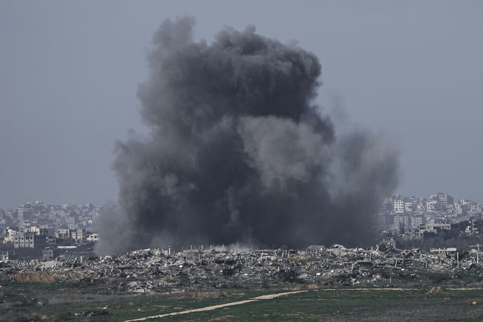 Smoke rises following an Israeli bombardment in Gaza on Sunday (Tsafrir Abayov/AP)