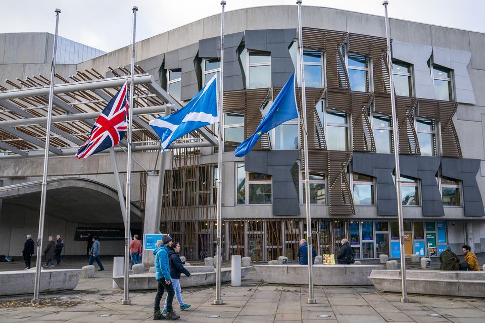 Flags were lowered to half-mast outside the Scottish Parliament while Holyrood paid tribute to Alex Salmond (Jane Barlow/PA)