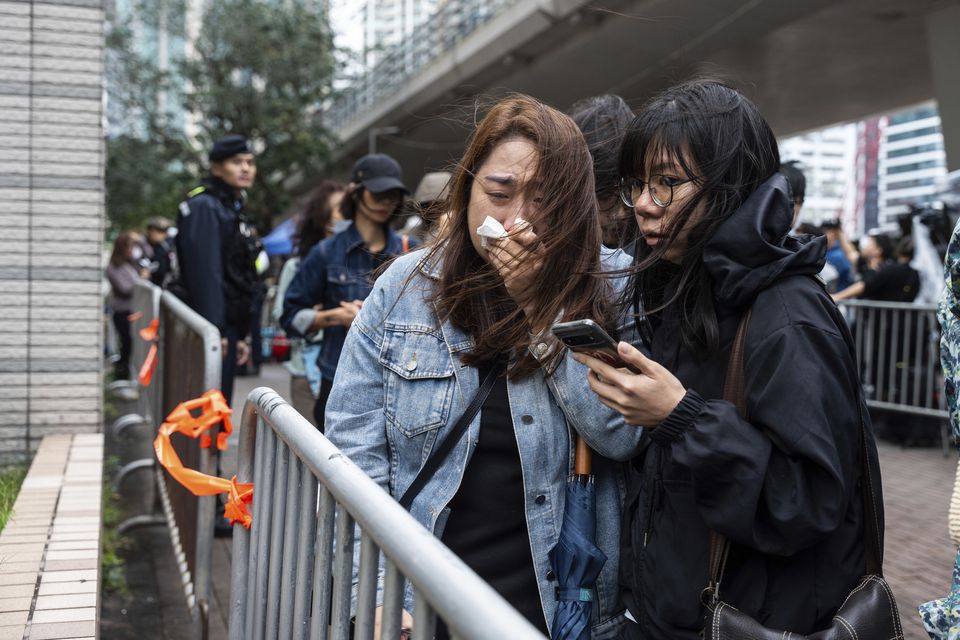 People gathered outside the court following the sentencing (Chan Long Hei/AP)