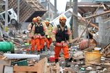 thumbnail: Members of a Korean rescue team walk through an area damaged by earthquake and tsunami after a 9.0 magnitude strong earthquake struck on March 11 off the coast of north-eastern Japan, on March 15, 2011 in Sendai, Japan. The quake struck offshore at 2:46pm local time, triggering a tsunami wave of up to 10 metres which engulfed large parts of north-eastern Japan. The death toll continues to rise with fears that the official death count could well reach up to 10,000 in "the most tragic event in Japanese history since World War Two".
