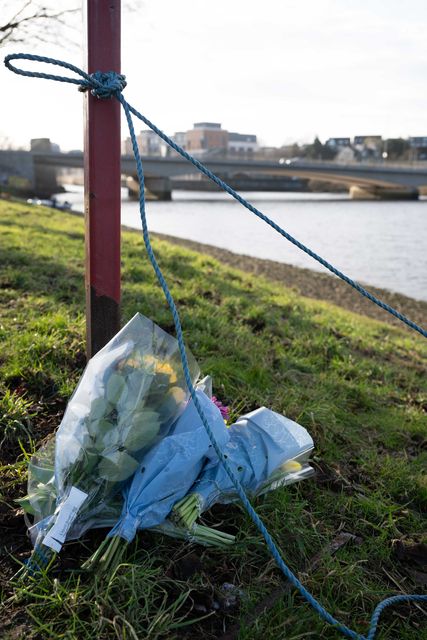 Flowers were left near to the Queen Elizabeth Bridge after the bodies were found (Michal Wachucik/PA)