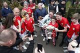 thumbnail: Cliftonville fans get a chance to have their picture taken with the Irish Cup after Cliftonville players arriveed at the Devinish bar on an open top bus to meets supporters, Monday, May 6, 2024.  Picture by Peter Morrison
