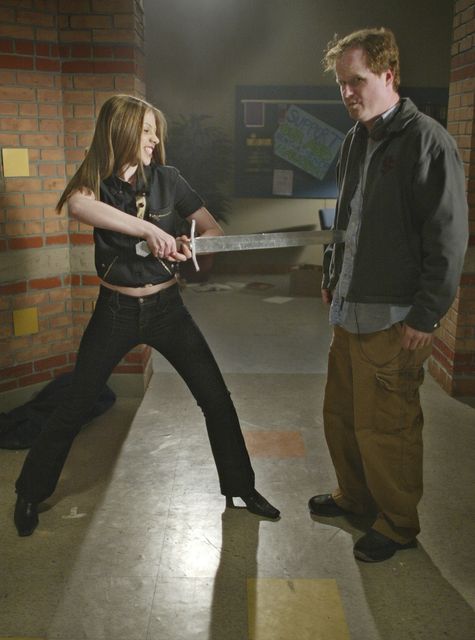 Michelle Trachtenberg, left, messing about on set with Buffy The Vampire Slayer creator Joss Whedon (Damian Dovarganes/AP)