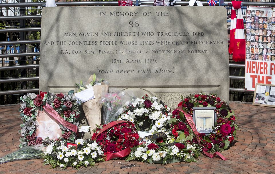 Flowers placed at the Hillsborough memorial plaque (Danny Lawson/PA)