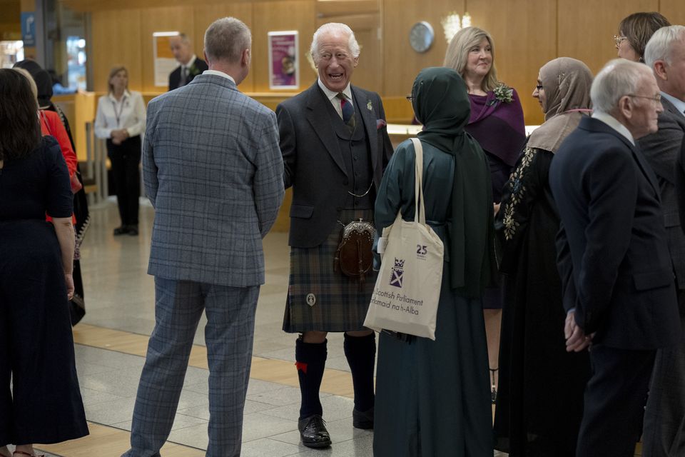 The King chatted to guests at a reception after a special ceremony to mark 25 years of the Scottish Parliament (Jane Barlow/PA)