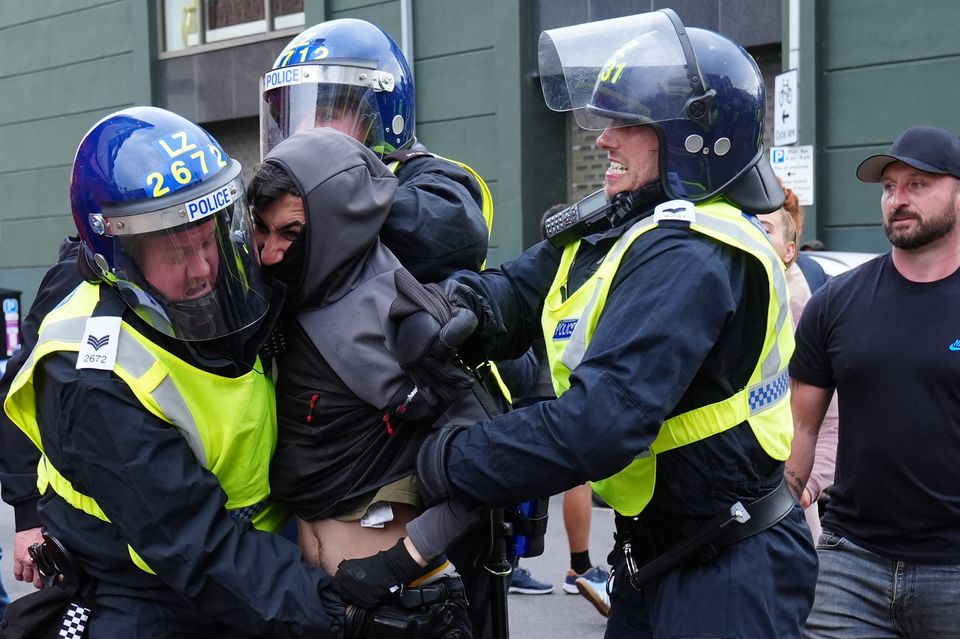 Police detain a man during an anti-immigration protest in Middlesbrough (Owen Humphreys/PA)