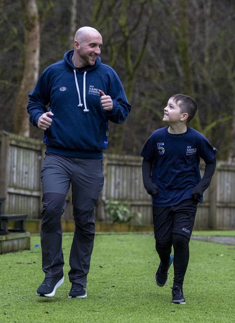 Harvey Dooher, 10, with his father David (My Name’5 Doddie Foundation/Jeff Holmes/PA)