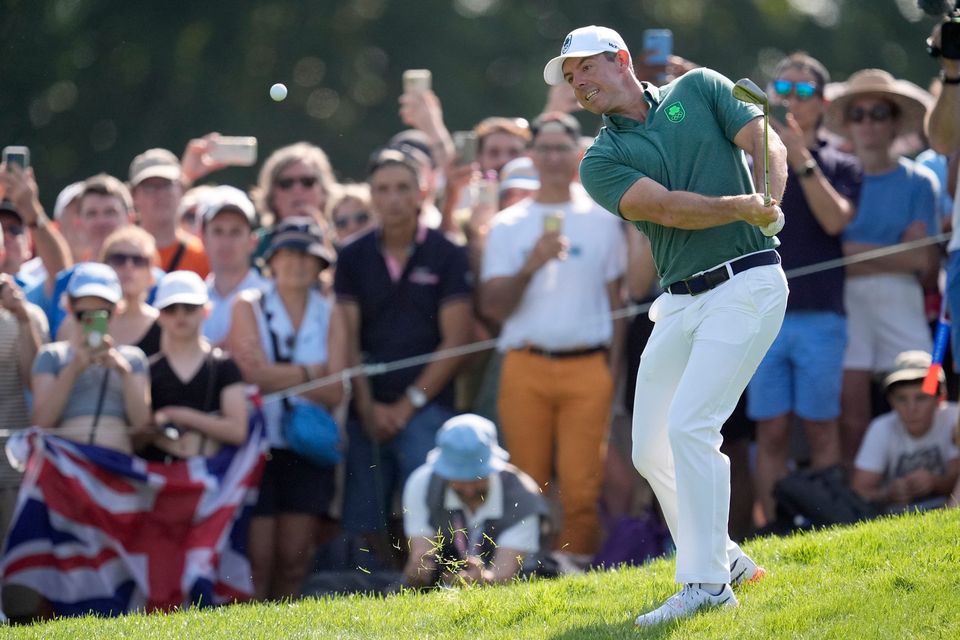 Ireland's Rory McIlroy chips onto the 3rd green.