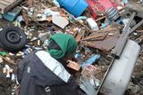 thumbnail: A local resident clears up in the area damaged by tsunami after a 9.0 magnitude strong earthquake struck on March 11 off the coast of north-eastern Japan, on March 15, 2011 in Sendai, Japan. The quake struck offshore at 2:46pm local time, triggering a tsunami wave of up to 10 metres which engulfed large parts of north-eastern Japan. The death toll continues to rise with fears that the official death count could well reach up to 10,000 in "the most tragic event in Japanese history since World War Two".