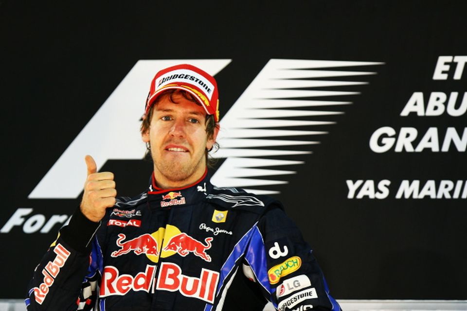 Red Bull driver Sebastian Vettel of Germany celebrates on his car