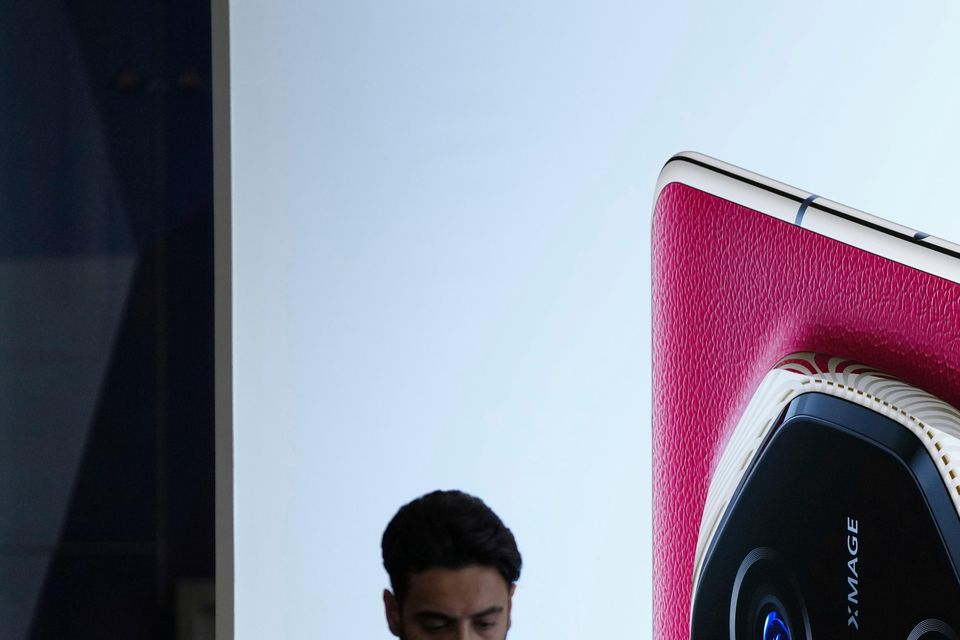 A giant billboard display of the phone during the opening of its global sales in Kuala Lumpur (Vincent Thian/AP)