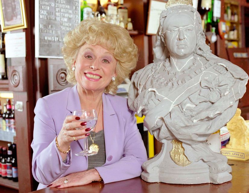 The late Barbara Windsor with the Queen Victoria bust from the EastEnders set. Credit: BBC/PA