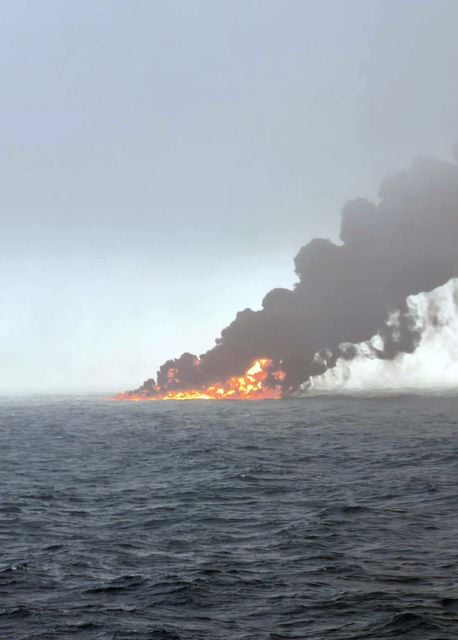 The two vessels remain on fire and coastguard aircraft are monitoring the situation (Bartek Smialek/PA)