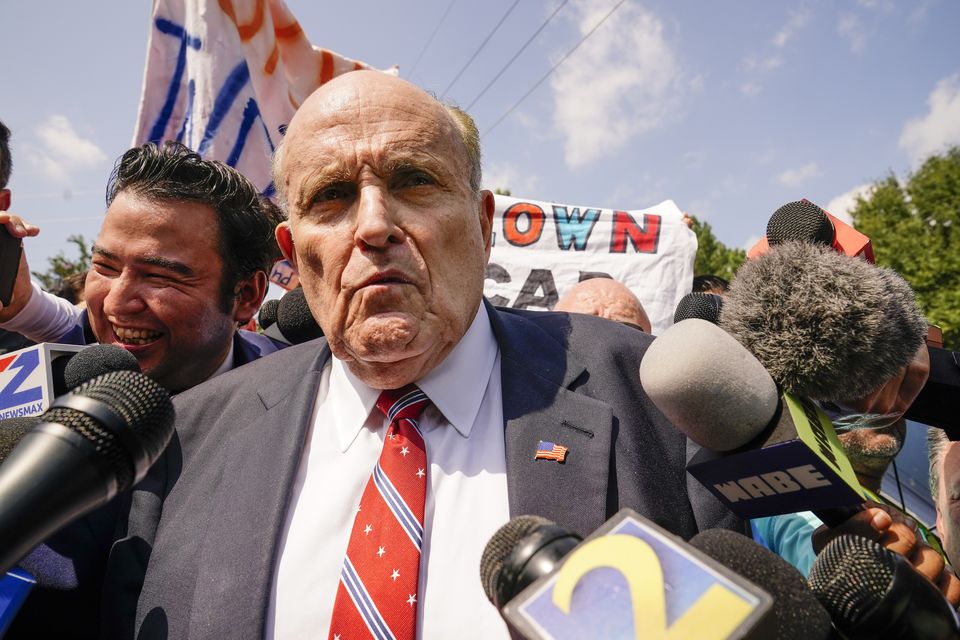 Rudy Giuliani speaks outside the Fulton County jail in Atlanta (AP)