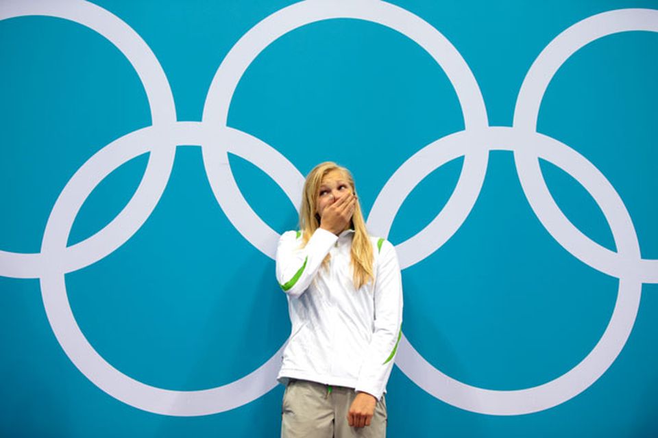 LONDON, ENGLAND - JULY 30:  Ruta Meilutyte of Lithuania reacts as she receives her gold medal during the medal ceremony for the Women's 100m Breaststroke on Day 3 of the London 2012 Olympic Games at the Aquatics Centre on July 30, 2012 in London, England.  (Photo by Adam Pretty/Getty Images)