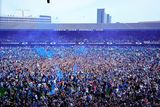 thumbnail: Fans on the pitch at Portman Road after Ipswich secured promotion.