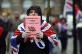 thumbnail: Loyalist protestors and PSNI officers pictured at Belfast City Hall on 22 December 2012