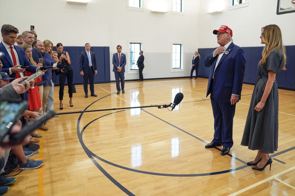 Donald and Melania Trump after they voted on Election Day at the Morton and Barbara Mandel Recreation Centre in Palm Beach, Florida (Evan Vucci/AP)