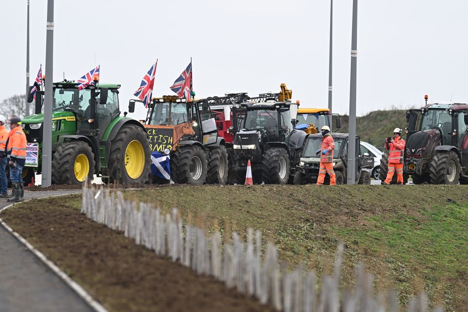 The noise from musical tractor horns filled the air during the Prime Minister’s trip to a development near Milton Keynes (Leon Neal/PA)