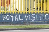 thumbnail: People walk past graffiti in Dublin city centre, ahead of the royal visit by  Queen Elizabeth II