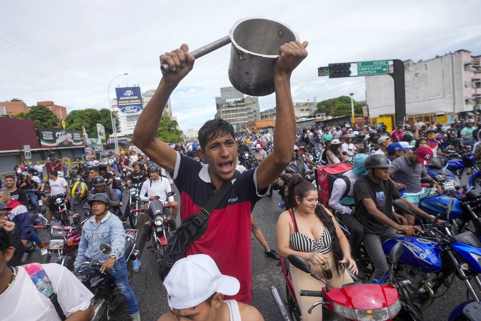 People protest the results in Caracas (Fernando Vergara/AP)