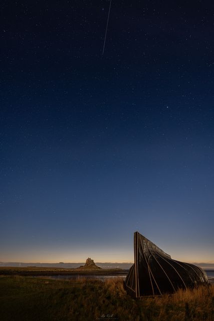 Photographer Lee Reid captured a shot of the Geminid meteor shower over Lindisfarne in Northumberland (Lee Reid/PA)