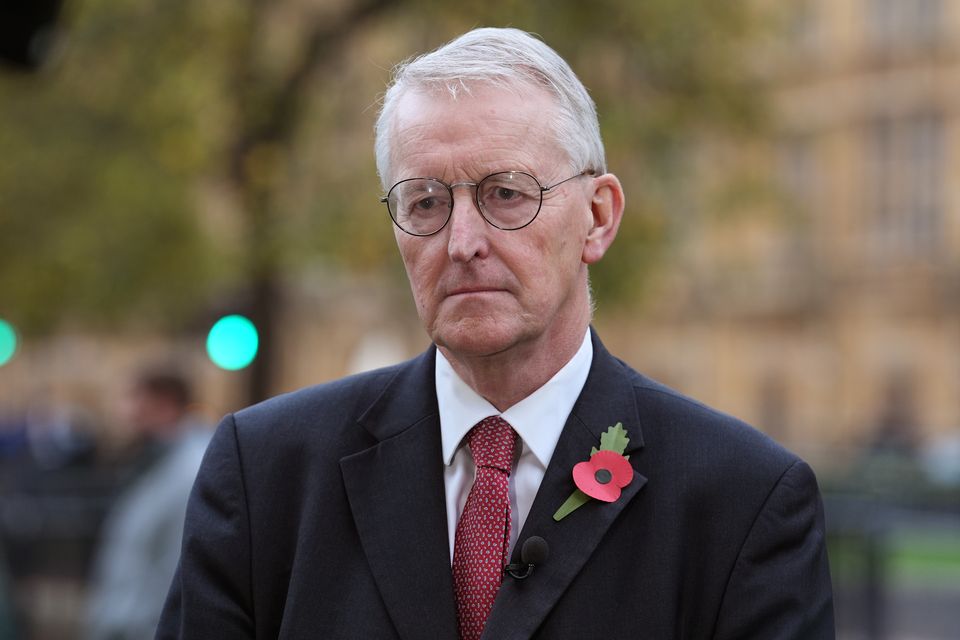 Northern Ireland Secretary Hilary Benn speaks to the media on College Green in Westminster after the budget was unveiled (Lucy North/PA)