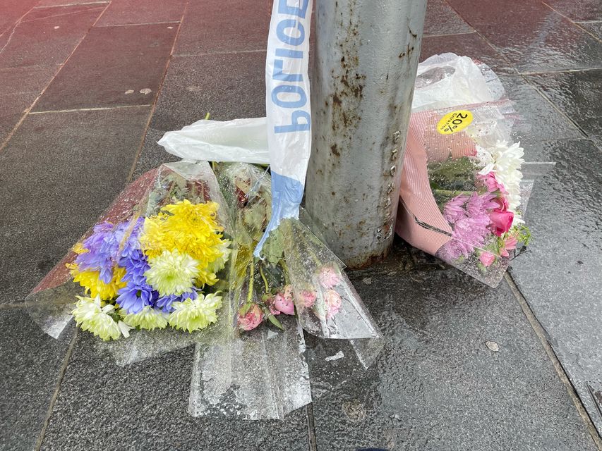 Floral tributes have been left close to the scene (Danielle Desouza/PA)