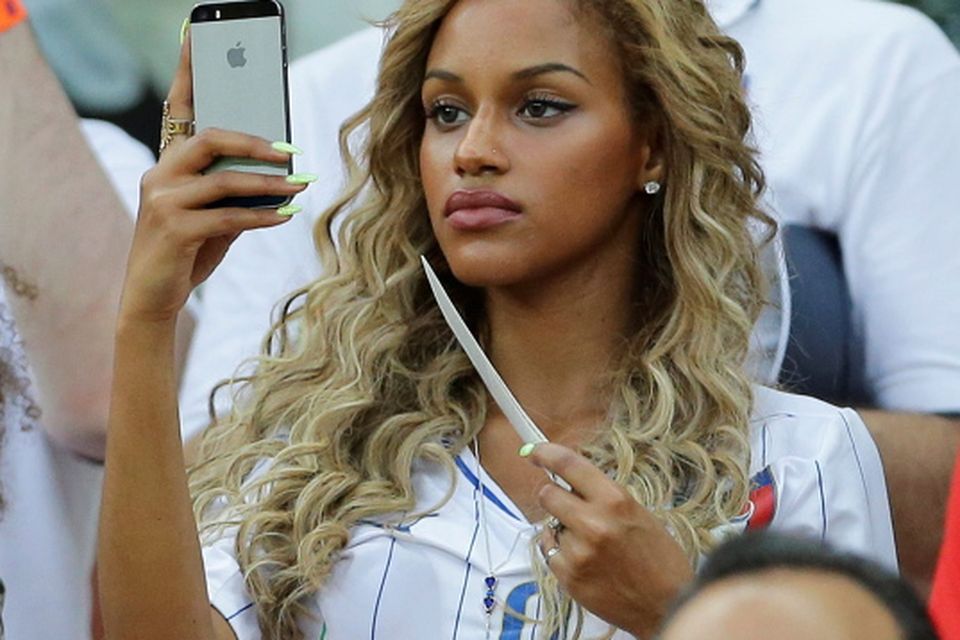 Belgian Fanny Neguesha, Mario Balotelli's girlfriend, attends at the group D World Cup soccer match between England and Italy at the Arena da Amazonia in Manaus, Brazil, Saturday, June 14, 2014. (AP Photo/Antonio Calanni)