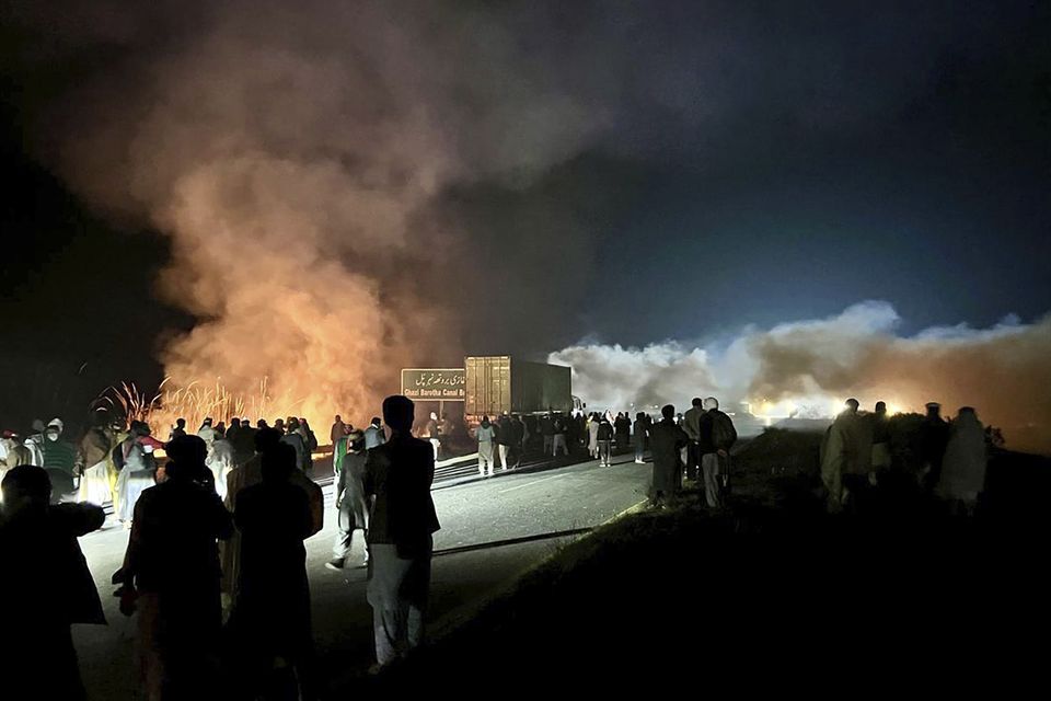 Police fired shells in an attempt to disperse activists during a protest demanding Imran Khan’s release (Maaz Awan/AP)