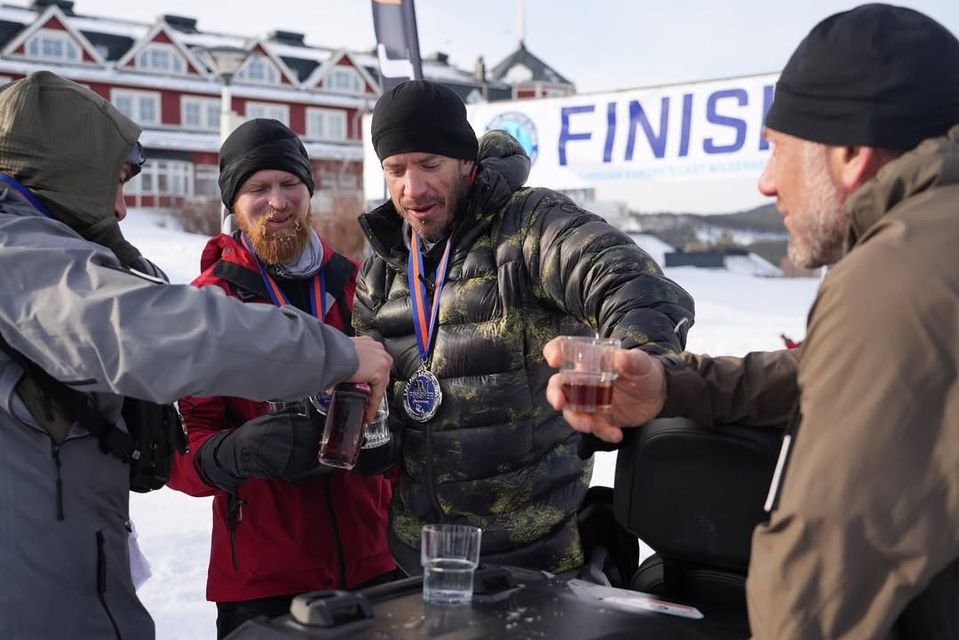 The team celebrating after crossing the finish line (Tony Parker/PA)