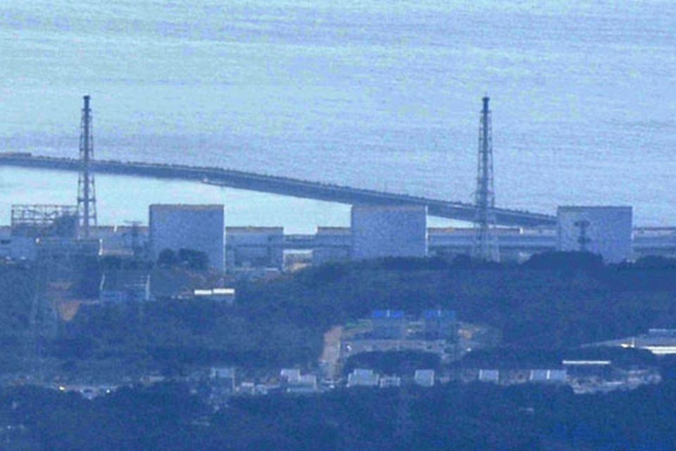 No. 3 unit of the Fukushima Daiichi Nuclear Power Plant, is seen, 2nd from right, with unit 1 reactor, left, with its top part of walls blown off after Saturday's explosion seen in Okumamachi, Fukushima Prefecture (state) , northern Japan Monday, March 14, 2011. Japanese officials say they believe a hydrogen explosion has occurred at the nuclear plant, similar to an earlier one at a different unit in the facility. (AP Photo/Kyodo News)  JAPAN OUT, MANDATORY CREDIT, NO SALES IN CHINA, HONG  KONG, JAPAN, SOUTH KOREA AND FRANCE