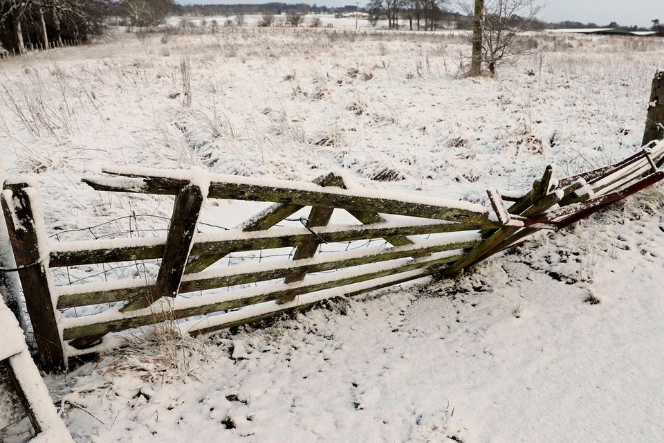 Snow covers a fence in Greenloaning, near Stirling, as blizzard conditions are set to bring "a real taste of winter to the whole of the UK". Andrew Milligan/PA Wire