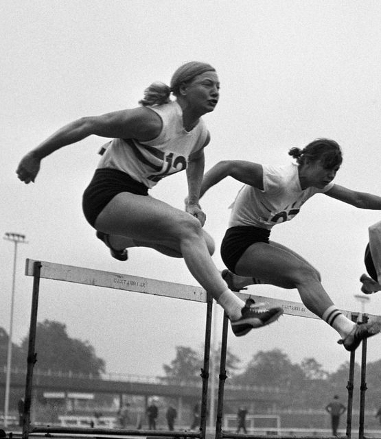 Mary Peters (left) competing early in her career in the first heat of the 80m hurdles of the Women’s Amateur Athletic Association’s national senior pentathlon, at the Crystal Palace Stadium in London (PA)