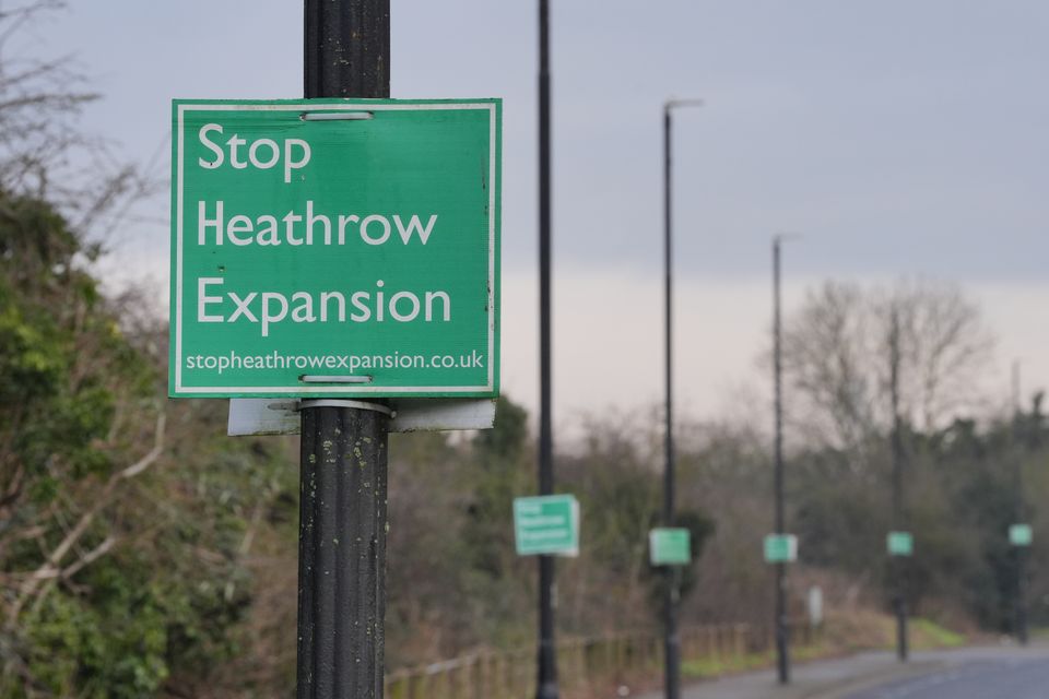 A “Stop Heathrow Expansion” sign is seen on a lamppost near Harmondsworth, one of the villages which would be affected (Jonathan Brady/PA)