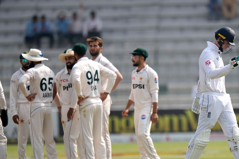 Zak Crawley walks off after being dismissed for 78 (Anjum Naveed/AP)