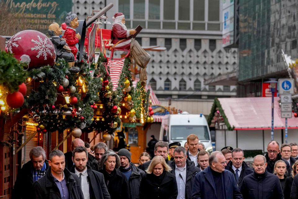 German Chancellor Olaf Scholz, centre, visited the scene of the tragedy in Magdeburg (AP Photo/Michael Probst)