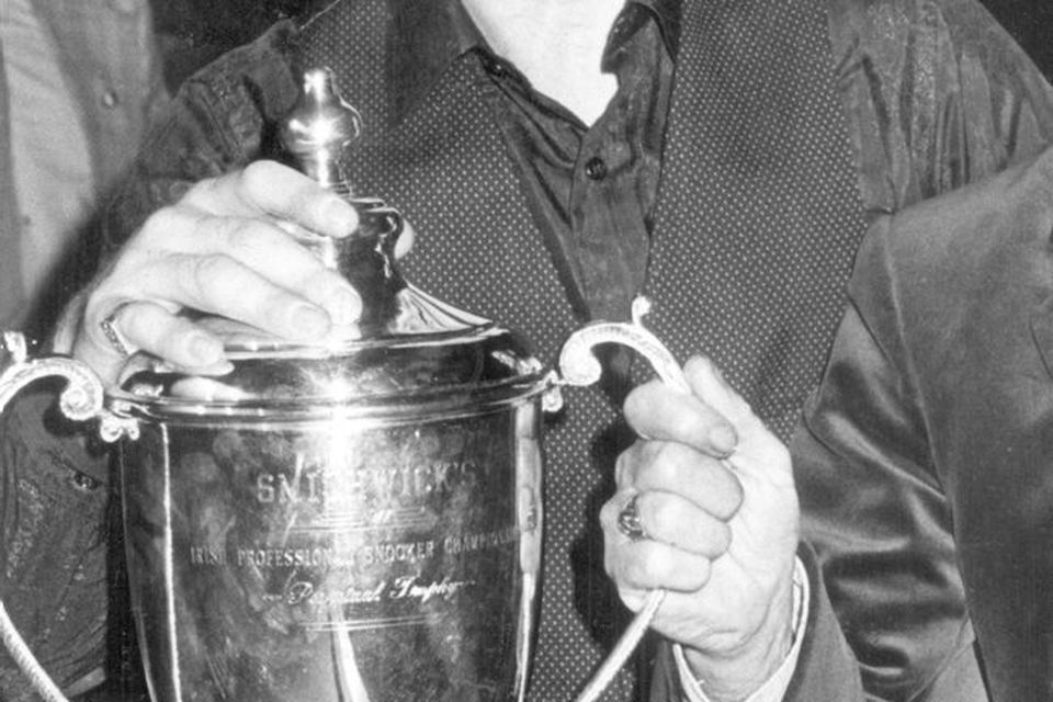 Alex Higgins.  Snooker Legend.  Alex Higgins, pictured with the championship trophy he intends to hold on to.  (12/03/1983)
