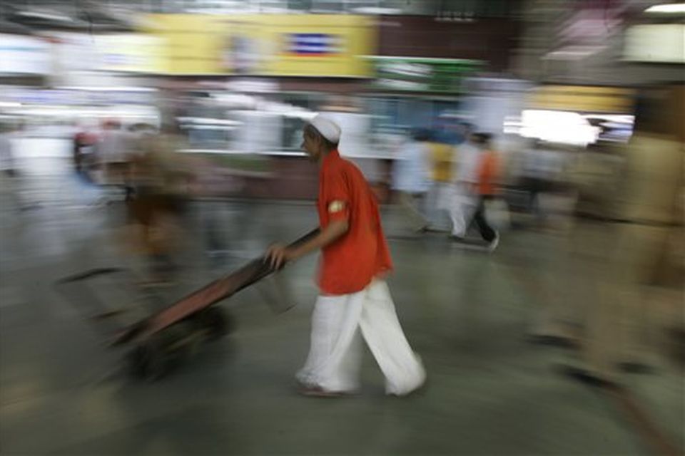 A worker pushes his handcart inside a waiting room at  Chhatrapati Shivaji railroad station where attacks began Wednesday with shooters spraying gunfire in Mumbai, India, Saturday, Nov. 29, 2008. Indian commandos killed the last remaining gunmen holed up at a luxury Mumbai hotel Saturday, ending a 60-hour rampage through India's financial capital by suspected Islamic militants that killed people and rocked the nation. (AP Photo/Altaf Qadri)