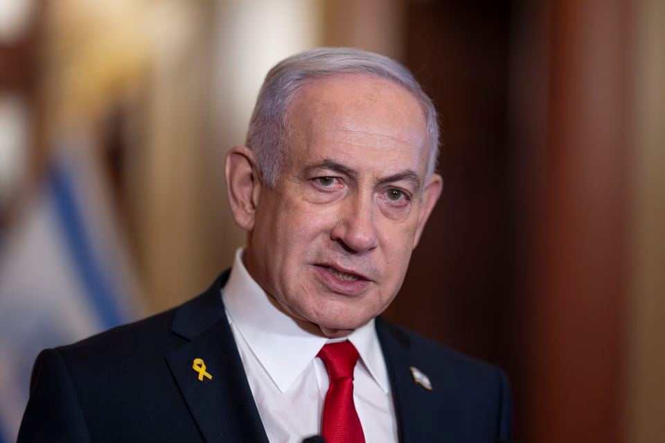 Mr Netanyahu speaks to reporters in the US (J Scott Applewhite/AP)