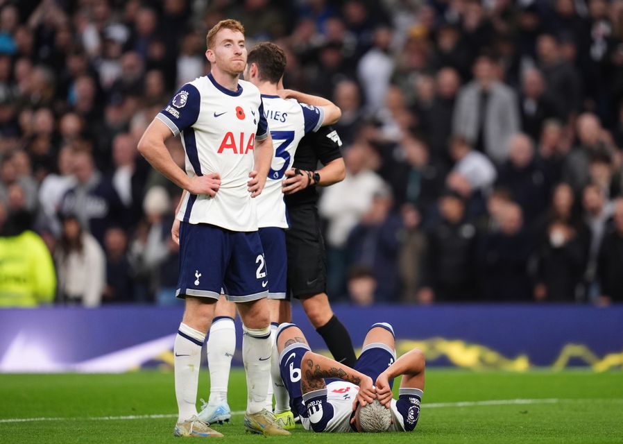 Richarlison lies in pain after picking up an injury (John Walton/PA)