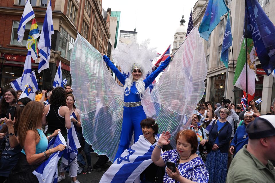 A counter-demonstration was held in Kensington but was marshalled by police officers (Jordan Pettitt/PA)