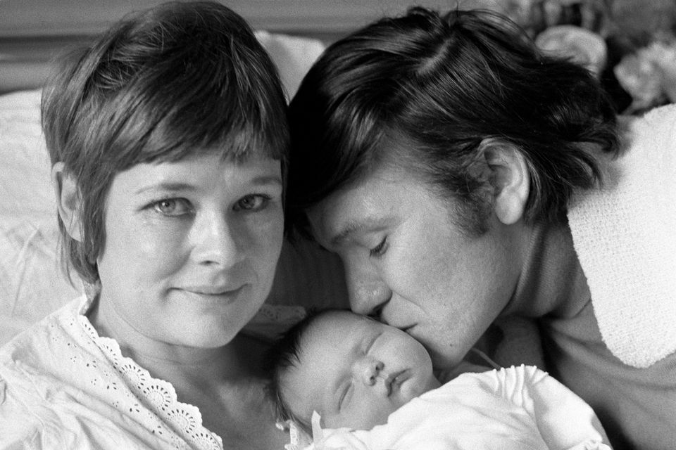 Judi Dench with Michael Williams and their newborn daughter (PA)