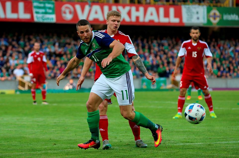 Northern Ireland's Conor Washington (left) and Belarus' Nikita Korzun battle for the ball during the International Friendly at Windsor Park, Belfast. PRESS ASSOCIATION Photo. Picture date: Friday May 27, 2016. See PA story SOCCER N Ireland. Photo credit should read: Niall Carson/PA Wire. RESTRICTIONS: Editorial use only, No commercial use without prior permission, please contact PA Images for further information: Tel: +44 (0) 115 8447447.