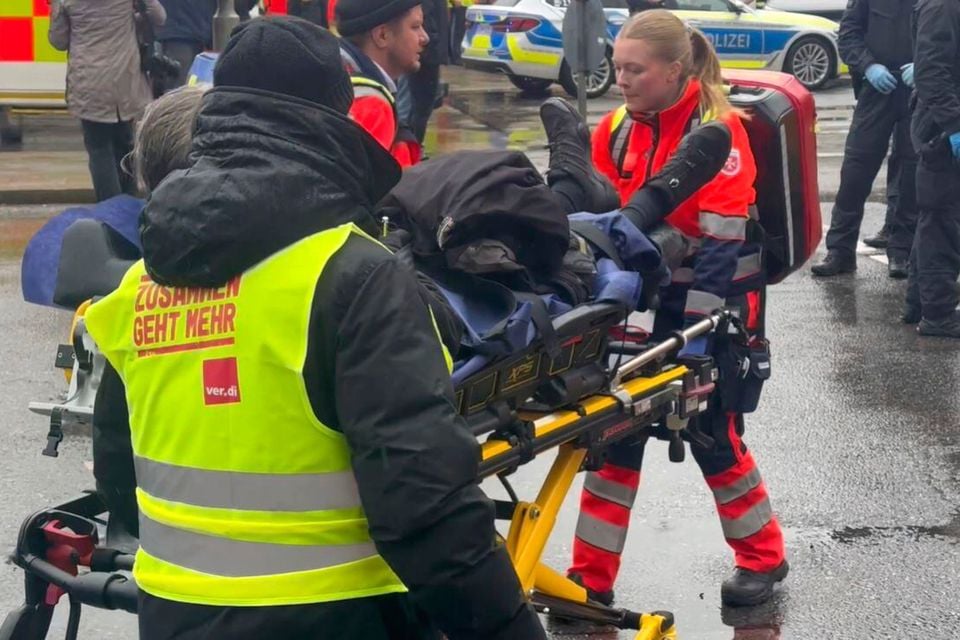 An injured person is taken away by emergency services at the scene of an accident after a driver hit a group of people in Munich, Germany, on Thursday. Pic: Michael Fischer/dpa via AP